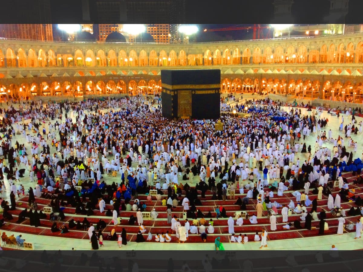 Muslim pilgrims performing tawaf around the Kaaba at night