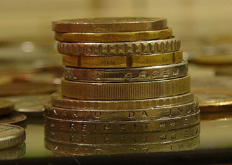 Piggy bank and coins representing Islamic charity