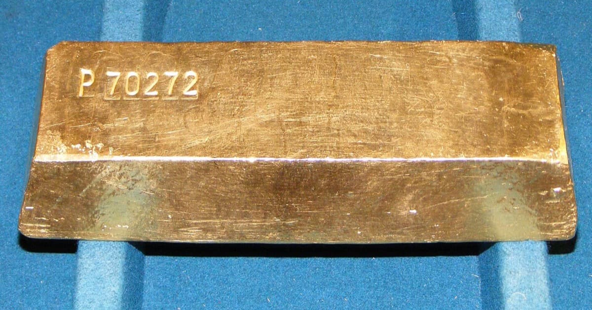 Gold bullion bars, symbolizing the wealth and gold nisab on which Zakat al-Mal is due