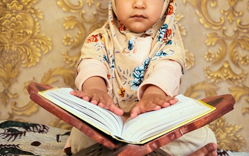 Person memorizing the Holy Quran