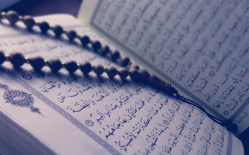 Quran with prayer beads