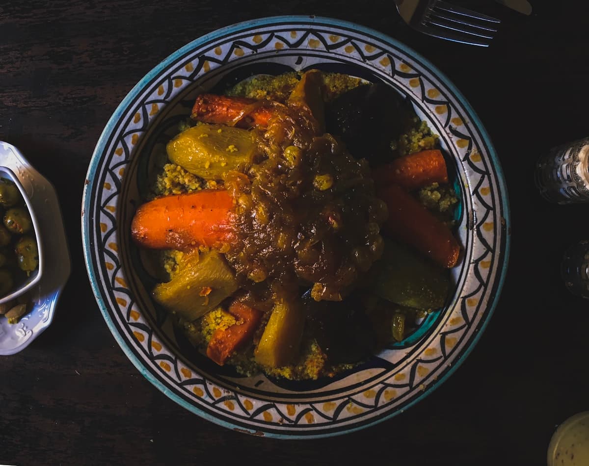 Traditional Moroccan lamb tagine served in a Fassi ceramic plate